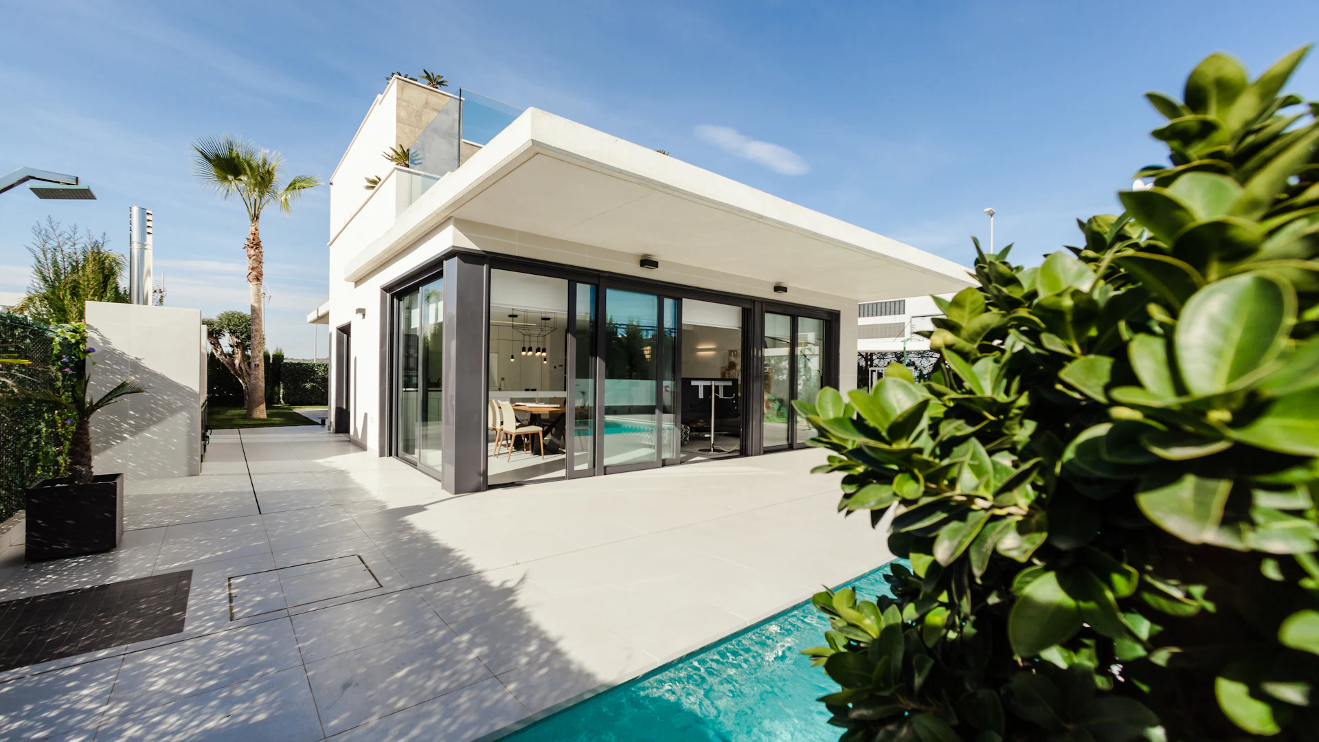 Luxury Florida coastal home with panoramic glass doors