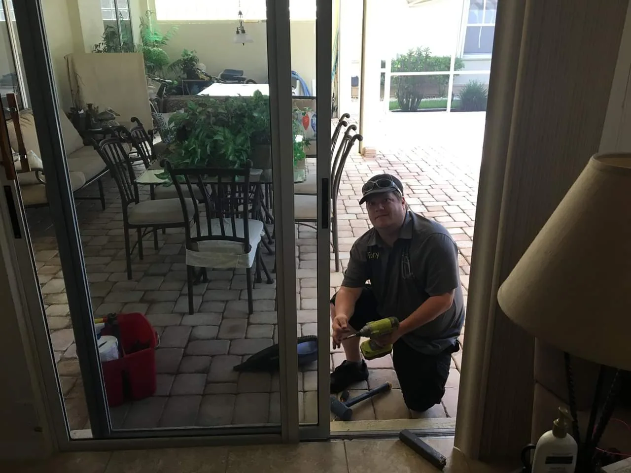 Slider Genius technician repairing a sliding glass door track on site